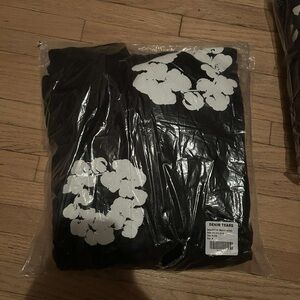 Denim Tears Black Hoodie with White Floral Design